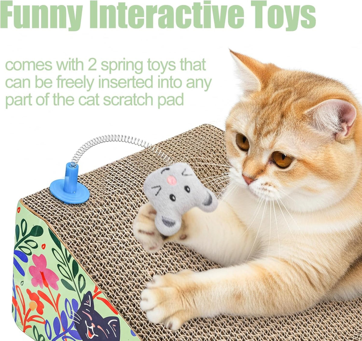 A cream-colored cat lies on a rectangular cat scratch pad with a small gray plush toy attached by a spring cord. The scratch pad has a brown corrugated waffle texture and a colorful floral side panel.
