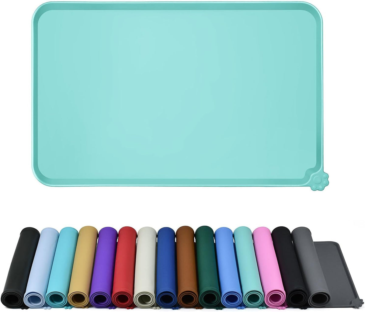 Mint green raised-edge silicone feeding mat above rolled mats in multiple colors.
