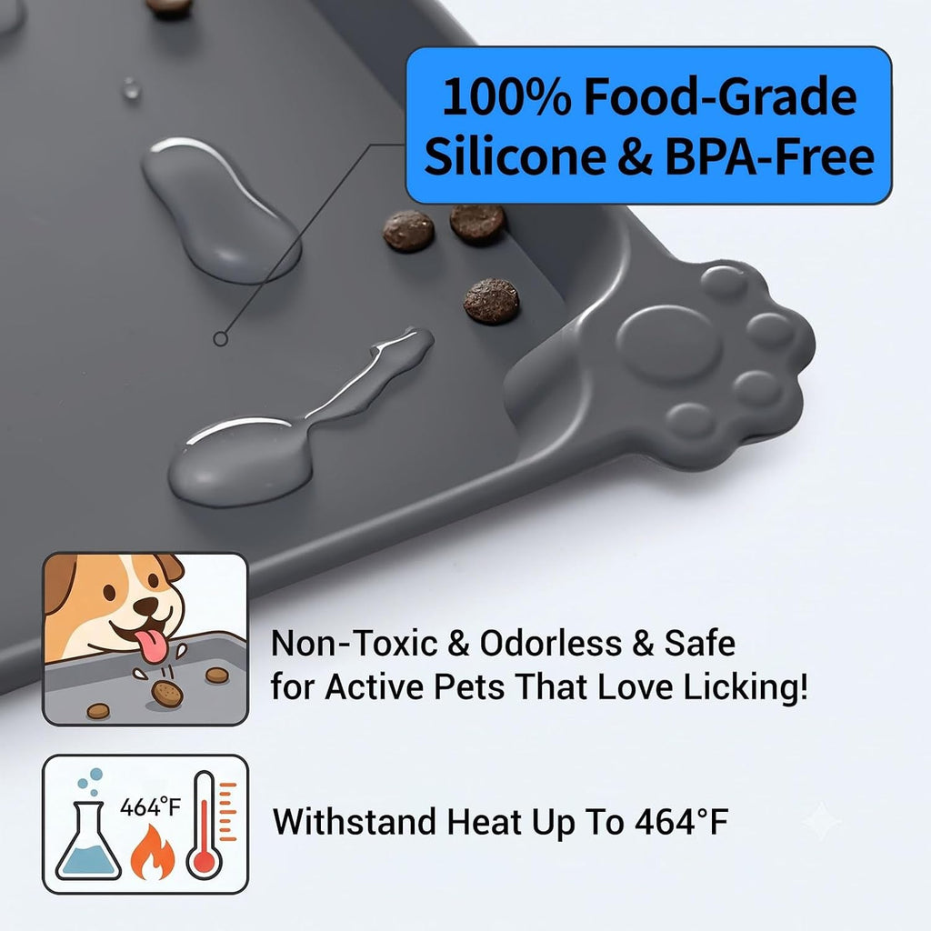 A dark gray silicone pet lick mat with a paw-shaped handle, shown with kibble pieces on top and marketing text overlays about food-grade silicone, BPA-free safety, and heat resistance.