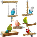 Seven different bird play trees and perches shown on a plain white background, each with a small colorful bird perched on it. The products include hanging branches with chains and a bell, angled wooden perches, a log platform with metal fasteners, and a larger log perch with a metal support arm.