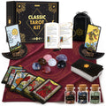 Classic Tarot Kit with cards, guidebook, burgundy cloth, stones, gemstone jars, pendulum, card holders, and storage bag.
