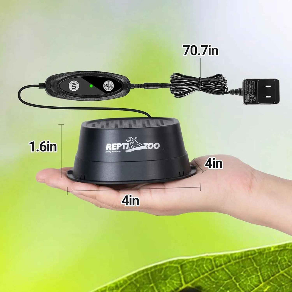 Black ReptiZoo product held in a hand with measurements indicated, on a green leaf background.