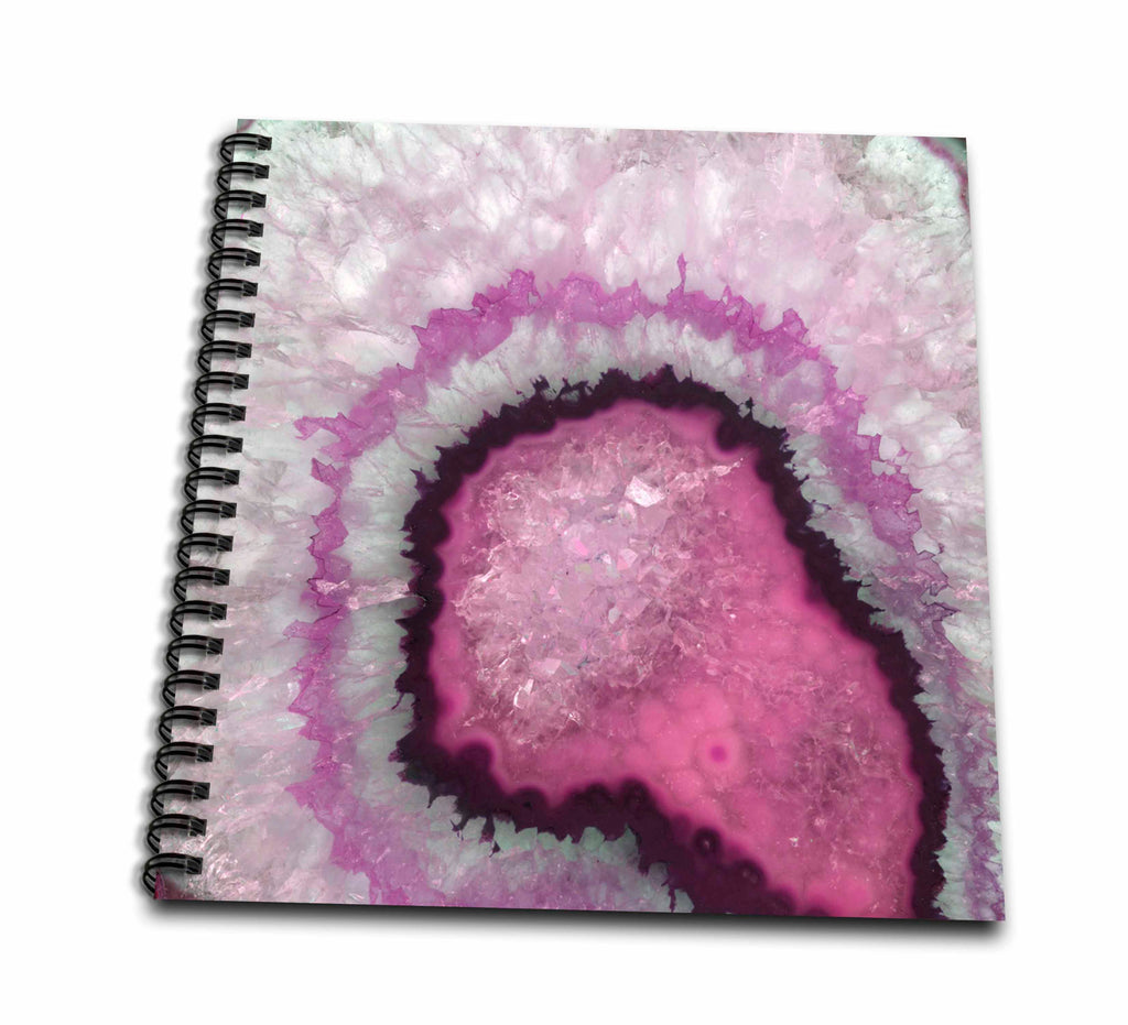 Pink and white crystal agate print on a drawing book cover with black wire binding along the left edge