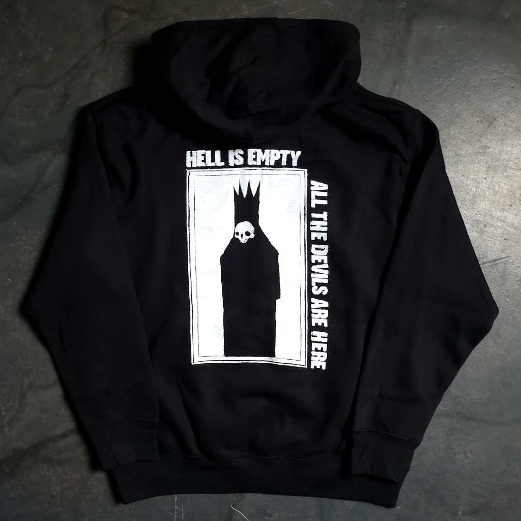 Black hoodie with graphic design and text on a dark surface