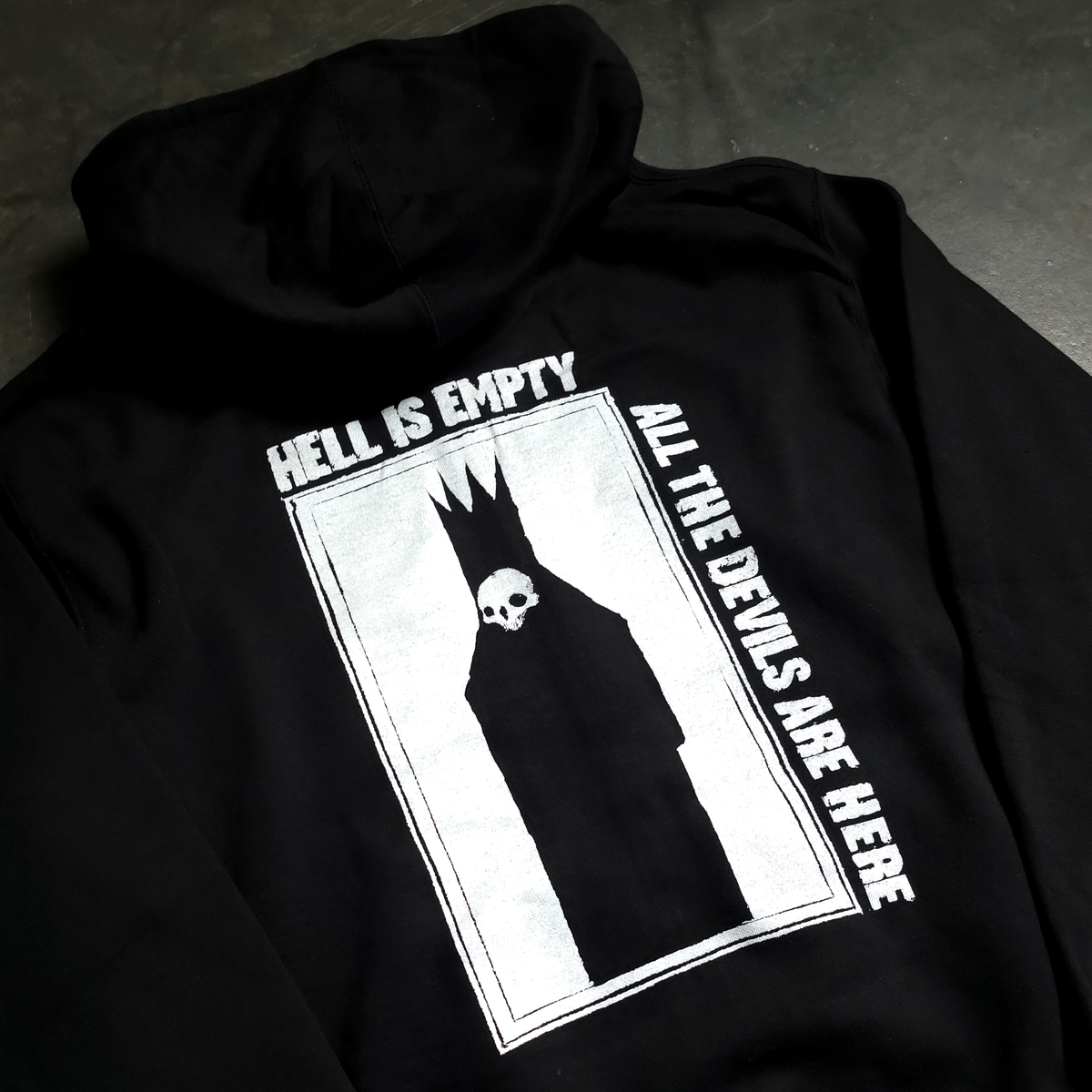 Close-up of printed graphic detail on Hell Is Empty hoodie