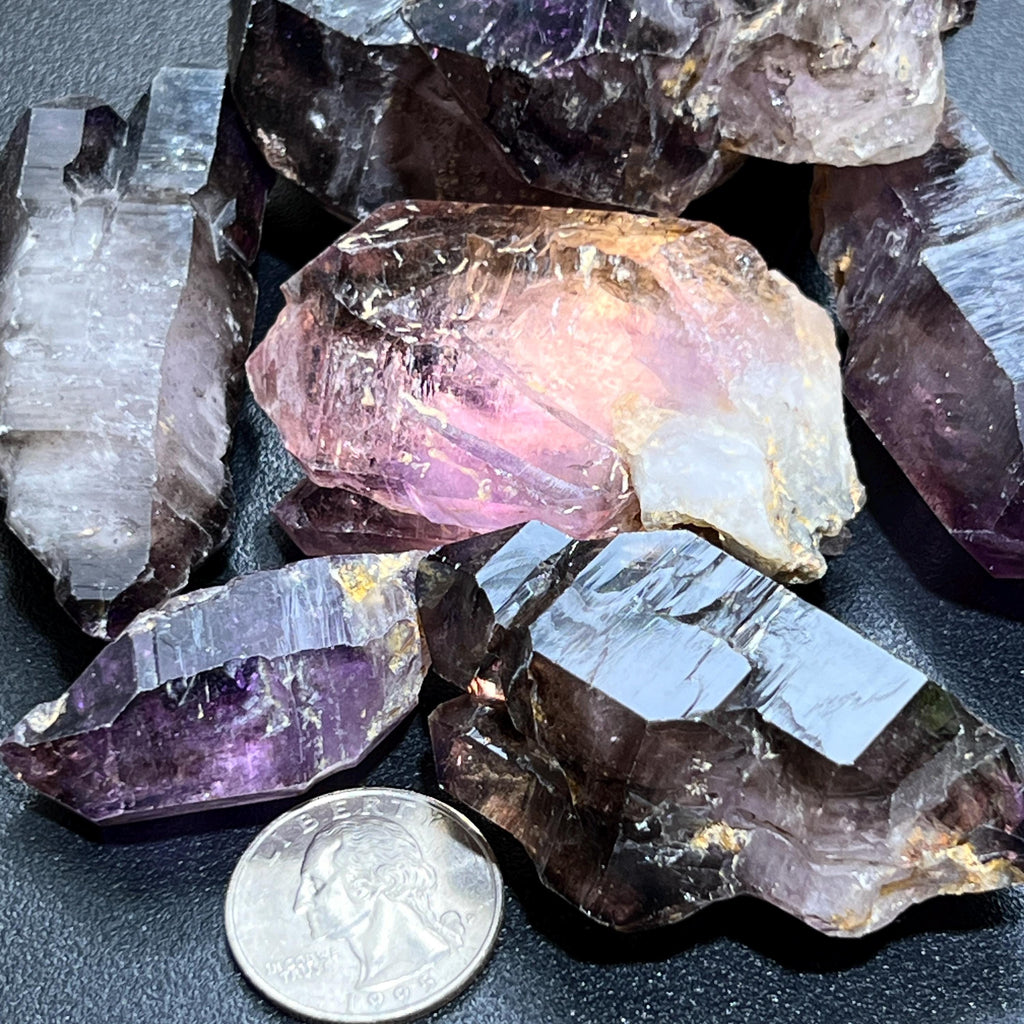  Smoky Shangaan amethyst points and scepters beside a quarter for size comparison.