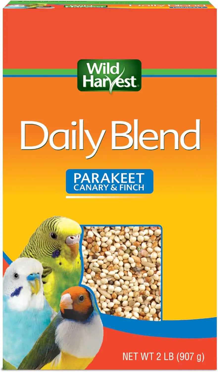 Box of Wild Harvest Daily Blend bird food for parakeets, canaries, and finches with colorful birds on an orange background.