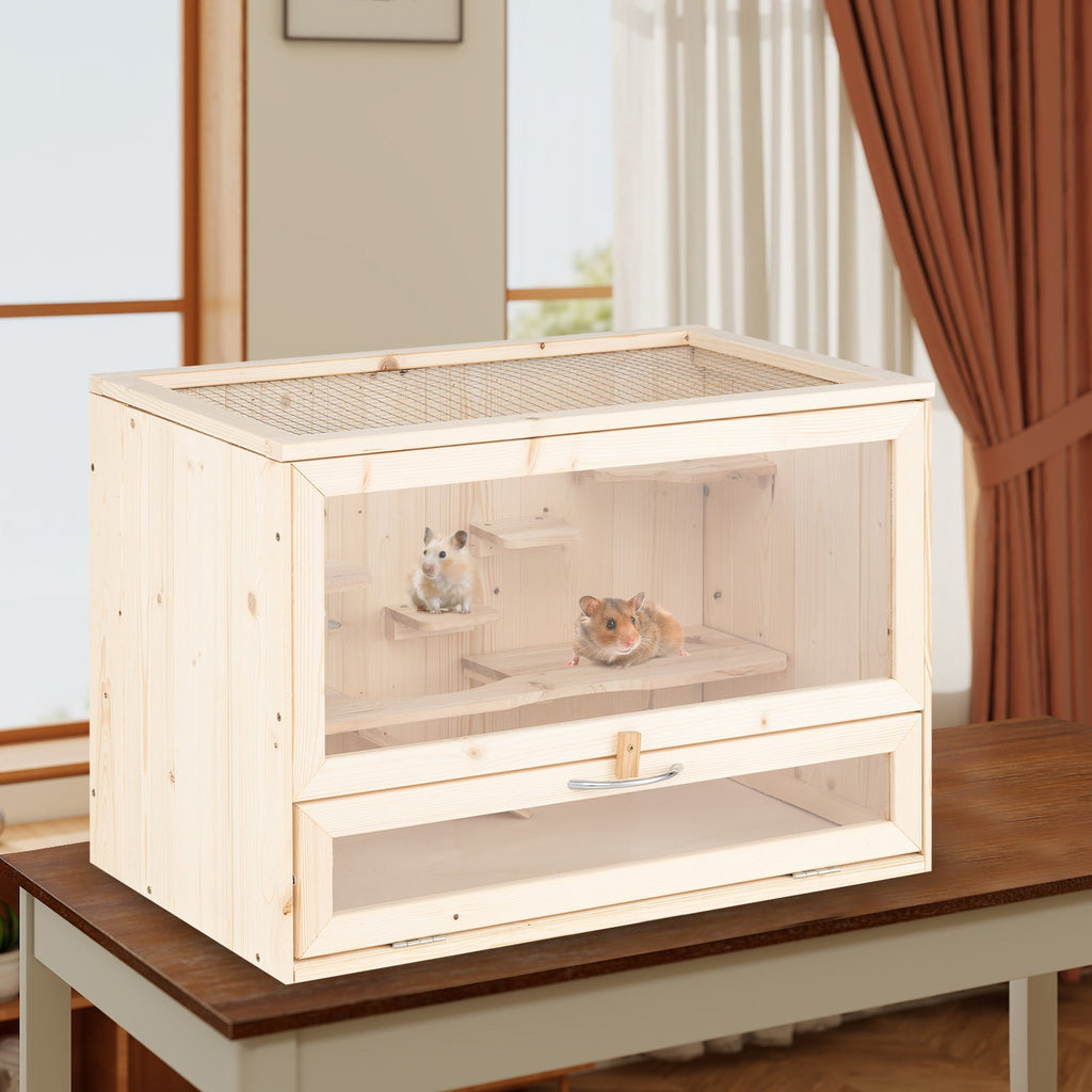 Wooden pet cage with two small animals on a wooden table