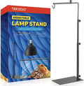 TEKIZOO adjustable lamp stand shown next to its retail packaging box. The lamp stand is made of matte black metal with a flat base, adjustable vertical pole, and a top hanging hook.