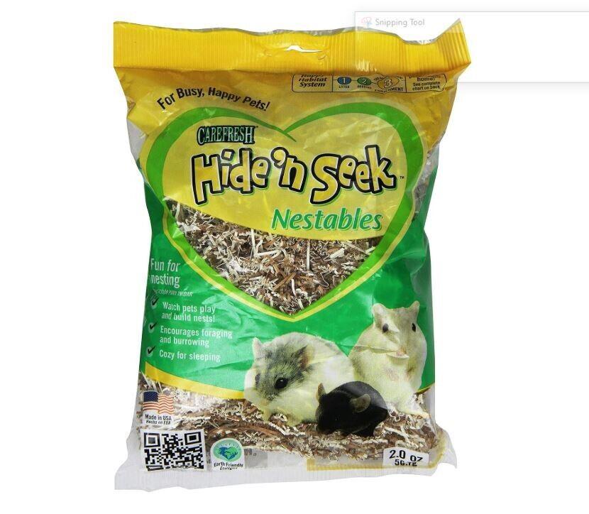 A 2.0 oz bag of CareFusion Hide 'n Seek Nestables bedding for hamsters and guinea pigs, featuring a yellow and green design with pictures of two hamsters on the front.