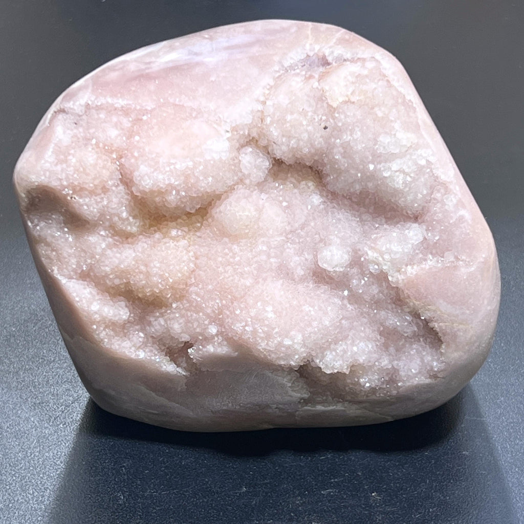 Pale pink amethyst standing freeform with sparkling druzy crystal pockets and a rounded polished outline