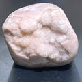 Pale pink amethyst standing freeform with sparkling druzy crystal pockets and a rounded polished outline