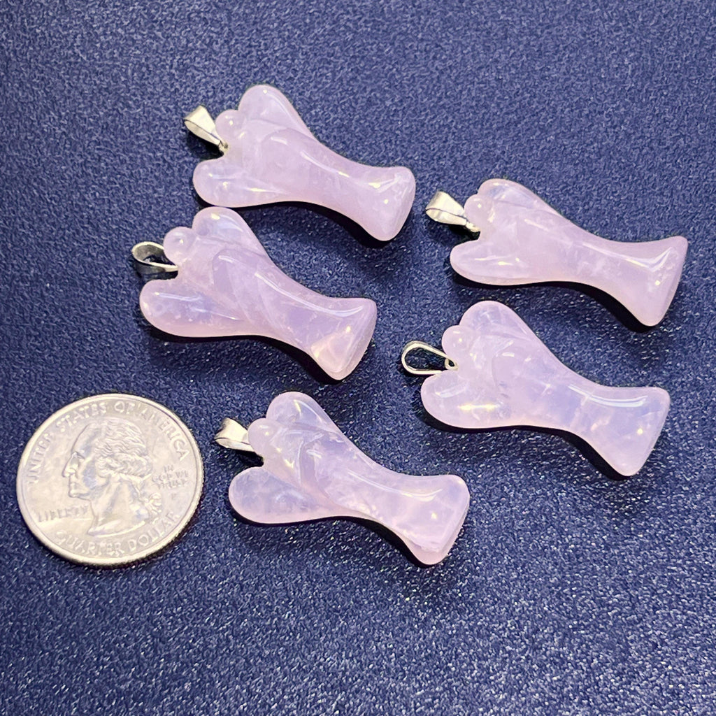 Five pink rose quartz angel pendants with silver-tone bails beside a quarter for size comparison.
