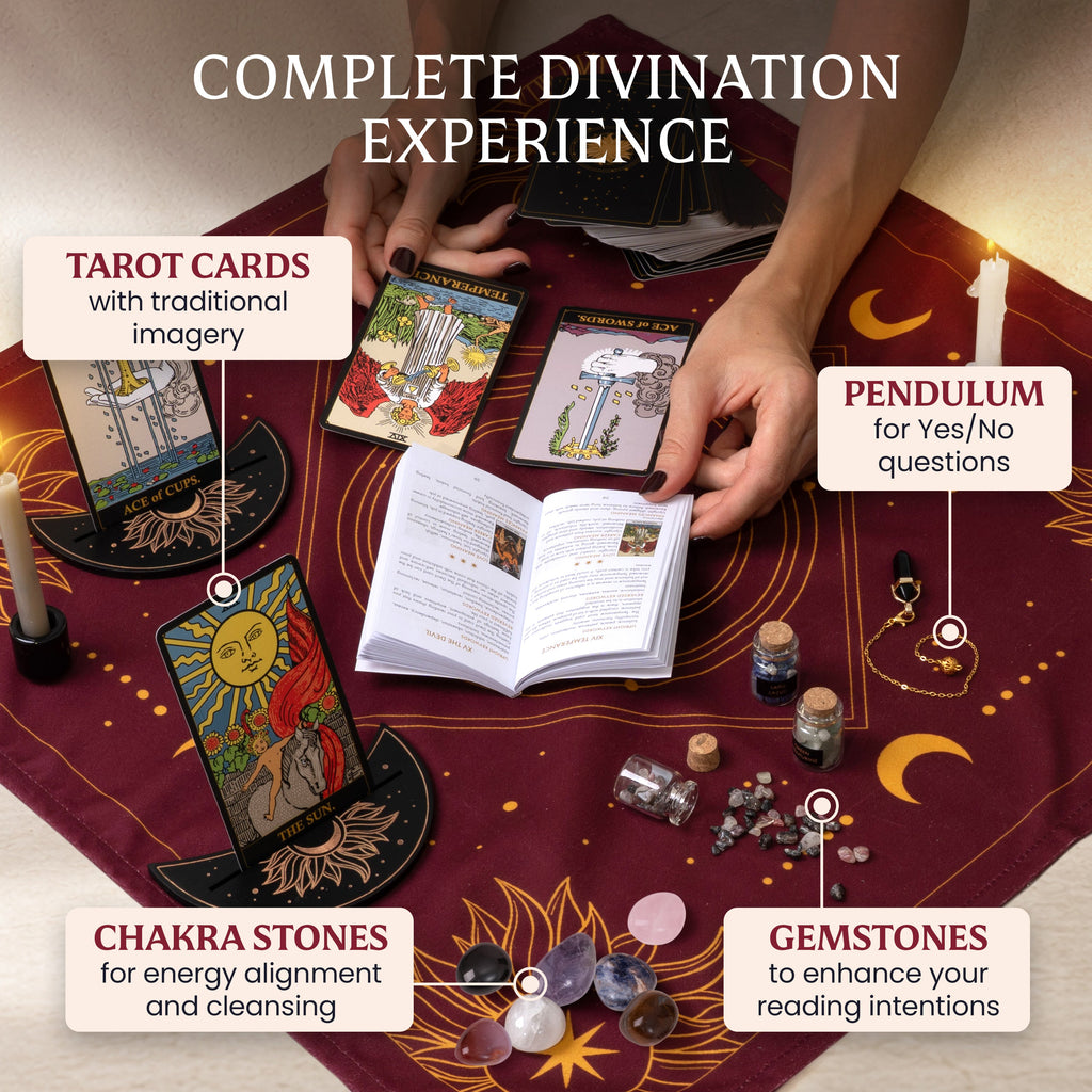 Hands consulting the tarot guidebook beside cards, a pendulum, chakra stones, and gemstone jars on a burgundy reading cloth.
