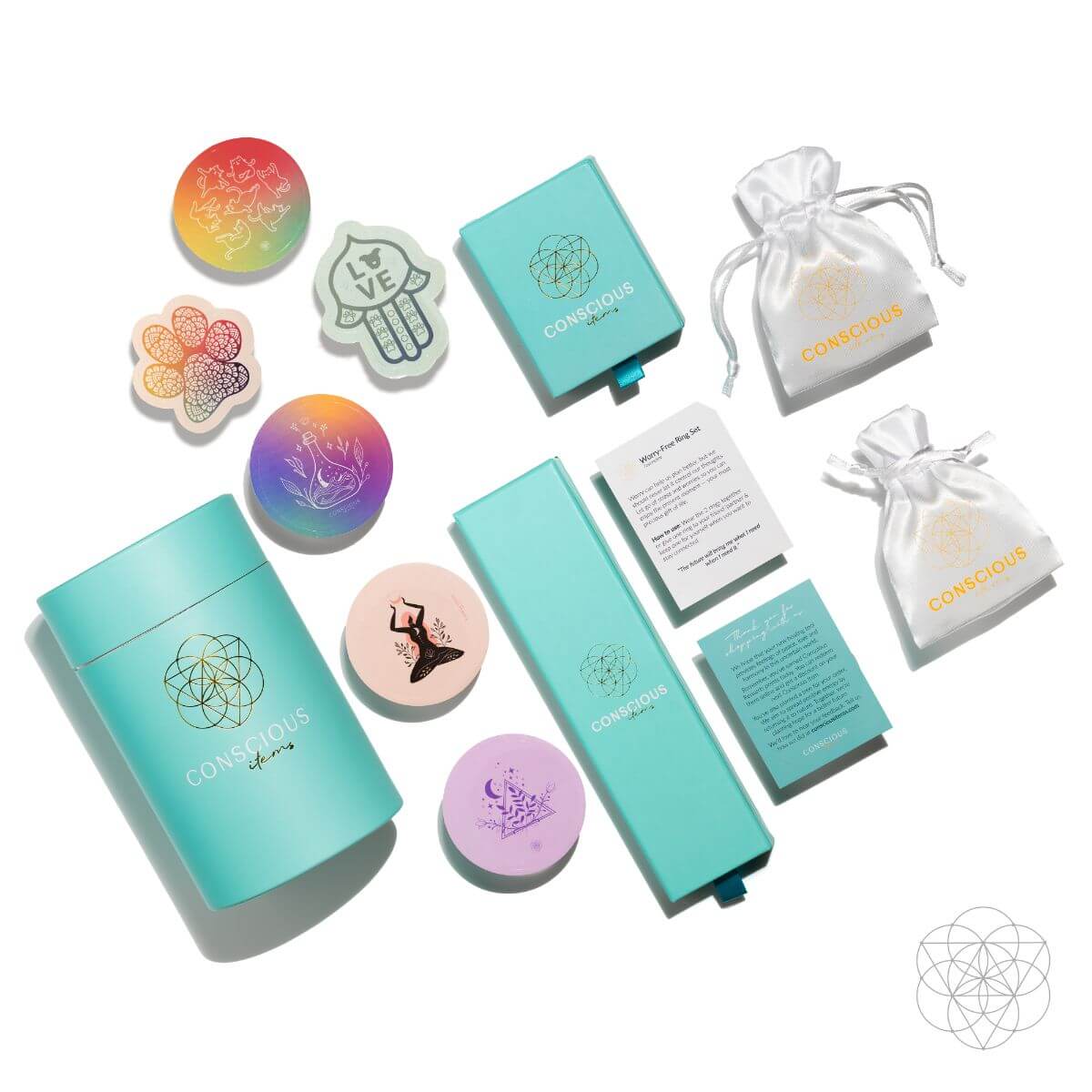 Conscious Items turquoise packaging, white drawstring pouches, printed cards, and colorful stickers.
